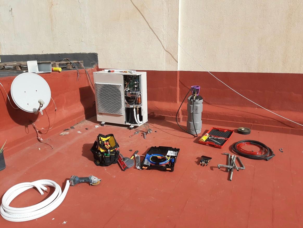 Hvac Technician Installing Modern Air Conditioning