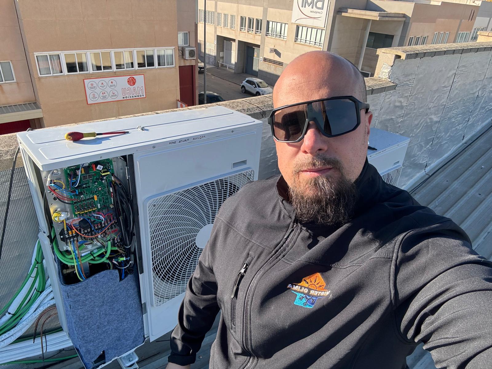 Modern Hvac Technician Working On Air Conditioning